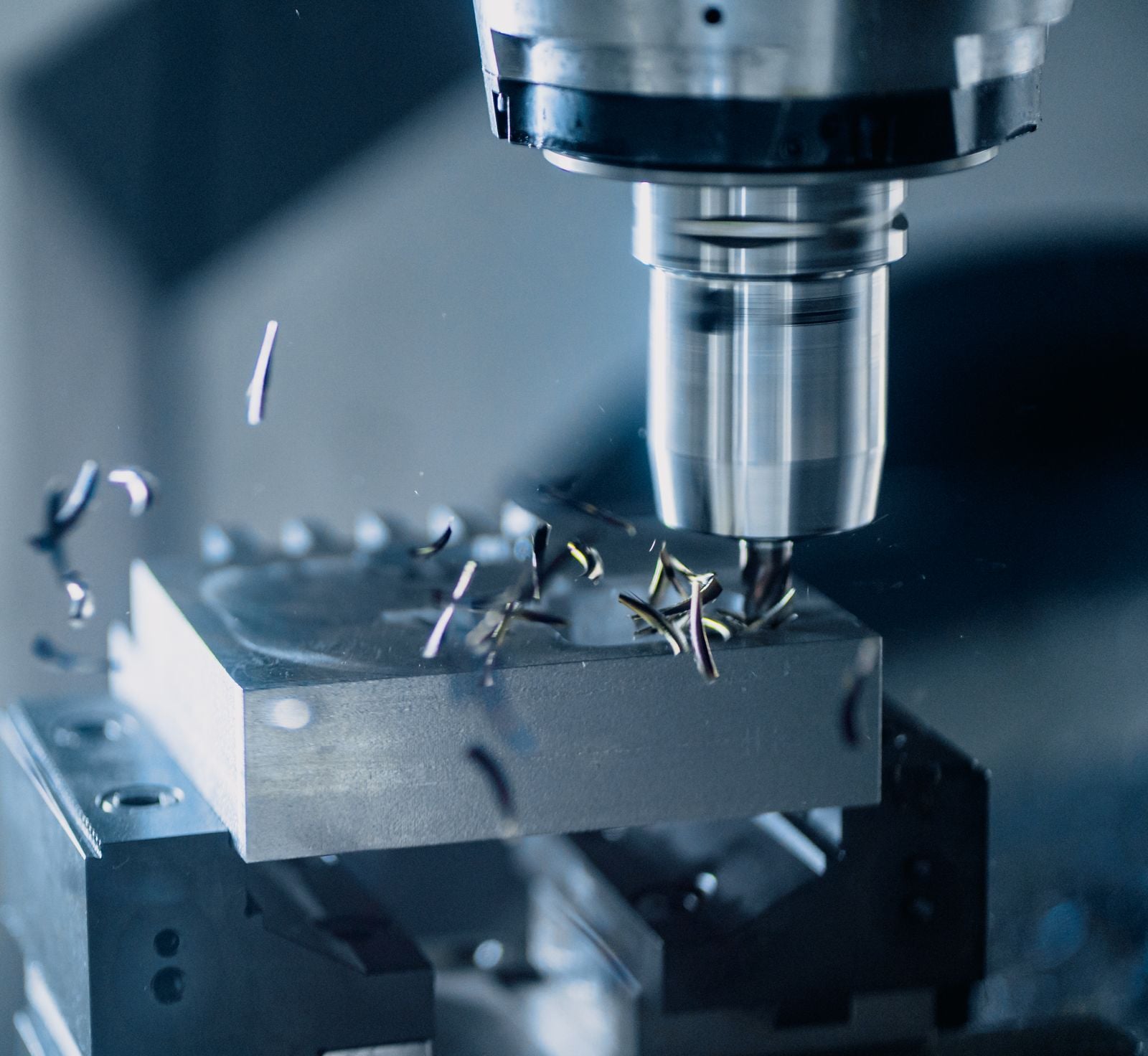 CNC machine cutting metal in a production environment